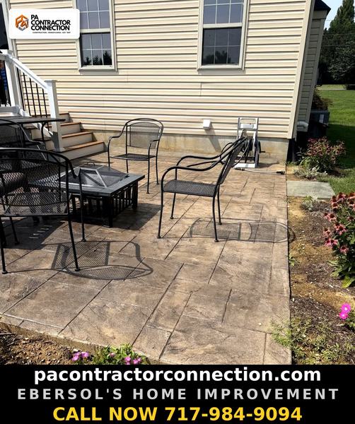 Ebersol's Home Improvement — stamped patio firepit house side