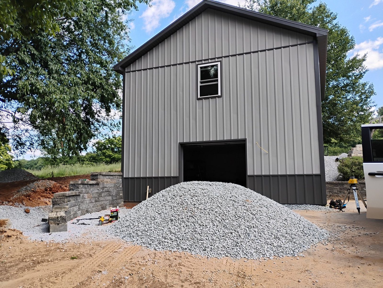 Completed gray metal outbuilding