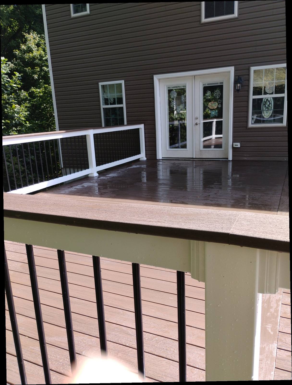 Finished brown deck with cable-style railing