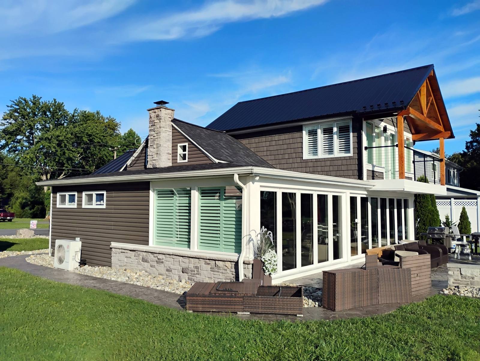 Completed blue metal outbuilding with white trim