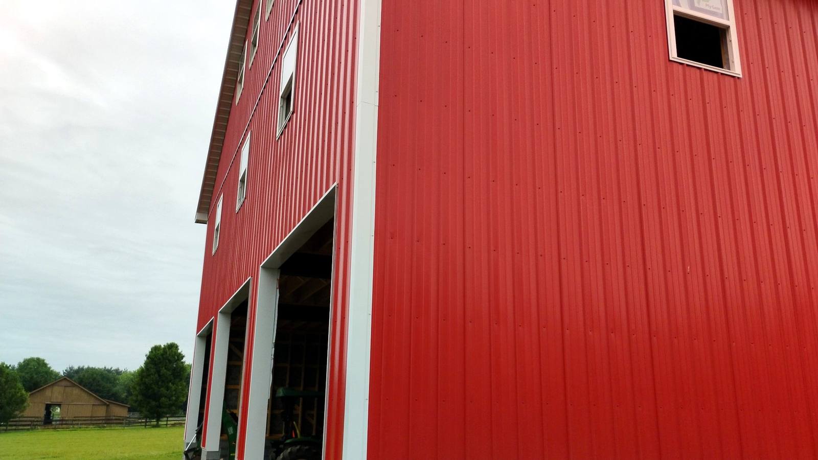 Finished red metal siding and exterior trim
