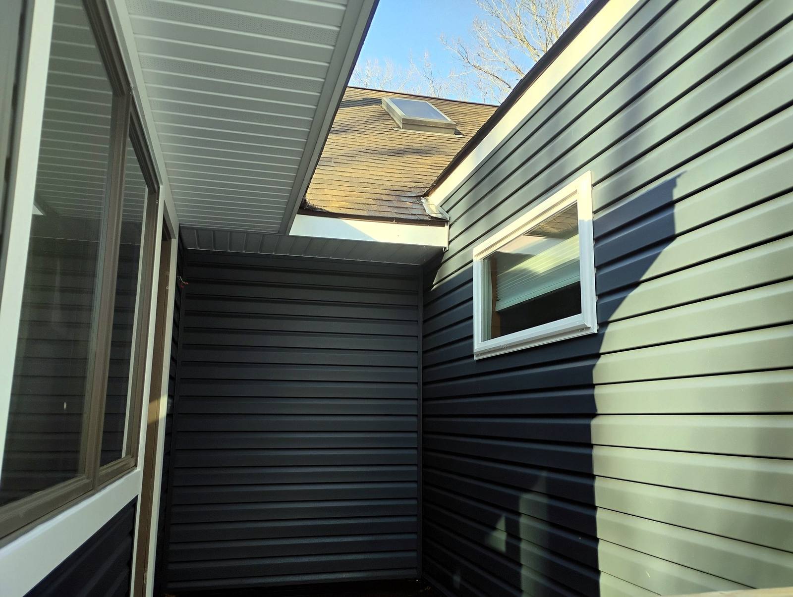 Completed exterior project beside mature trees