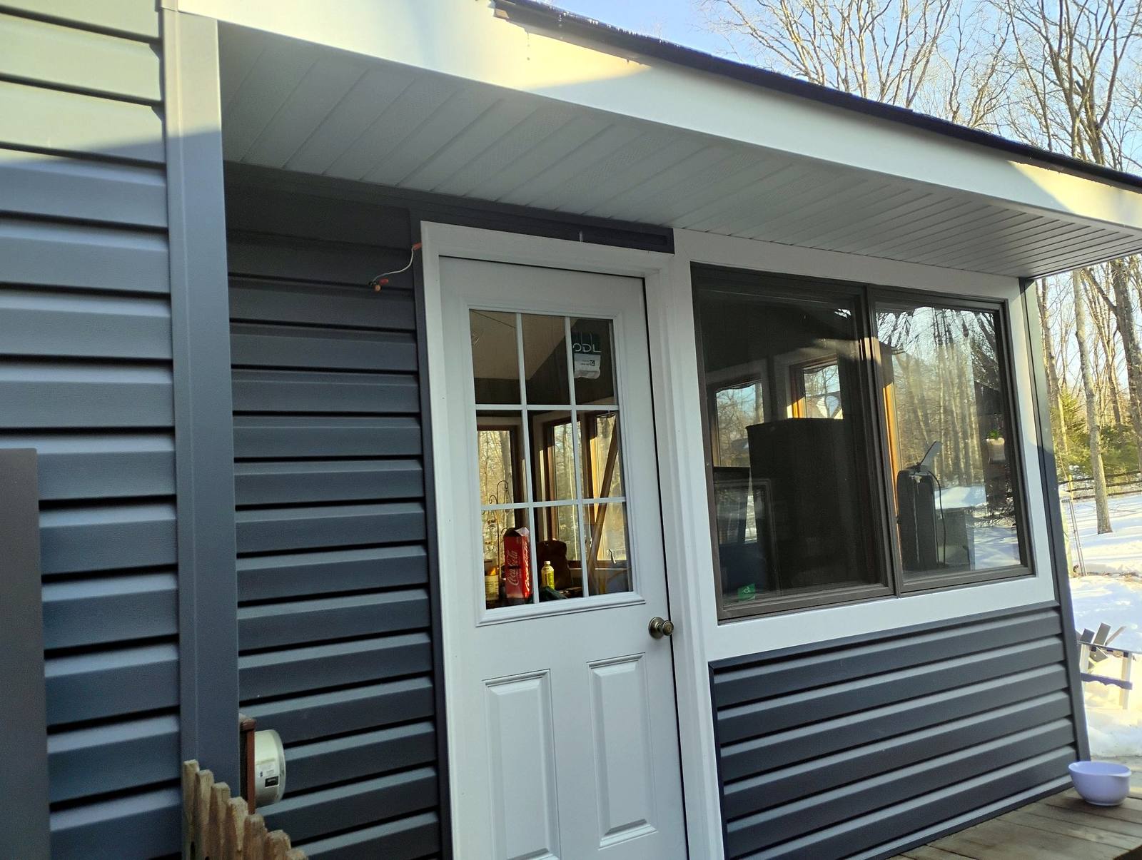 Finished compact outbuilding with covered entry