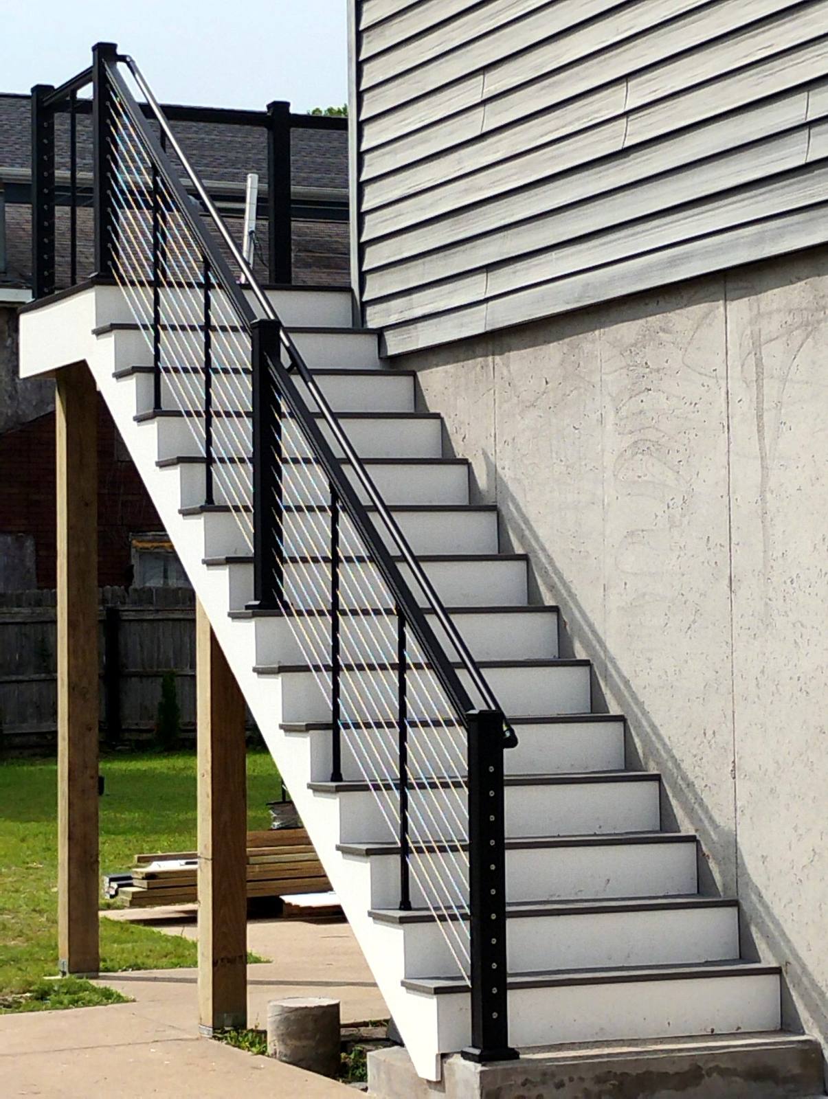 Exterior stairway with black metal railing