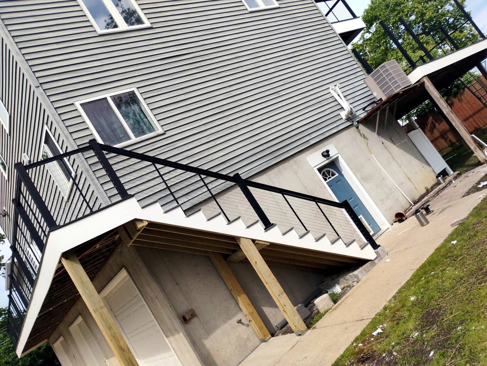 Second-story deck with black cable-style railing