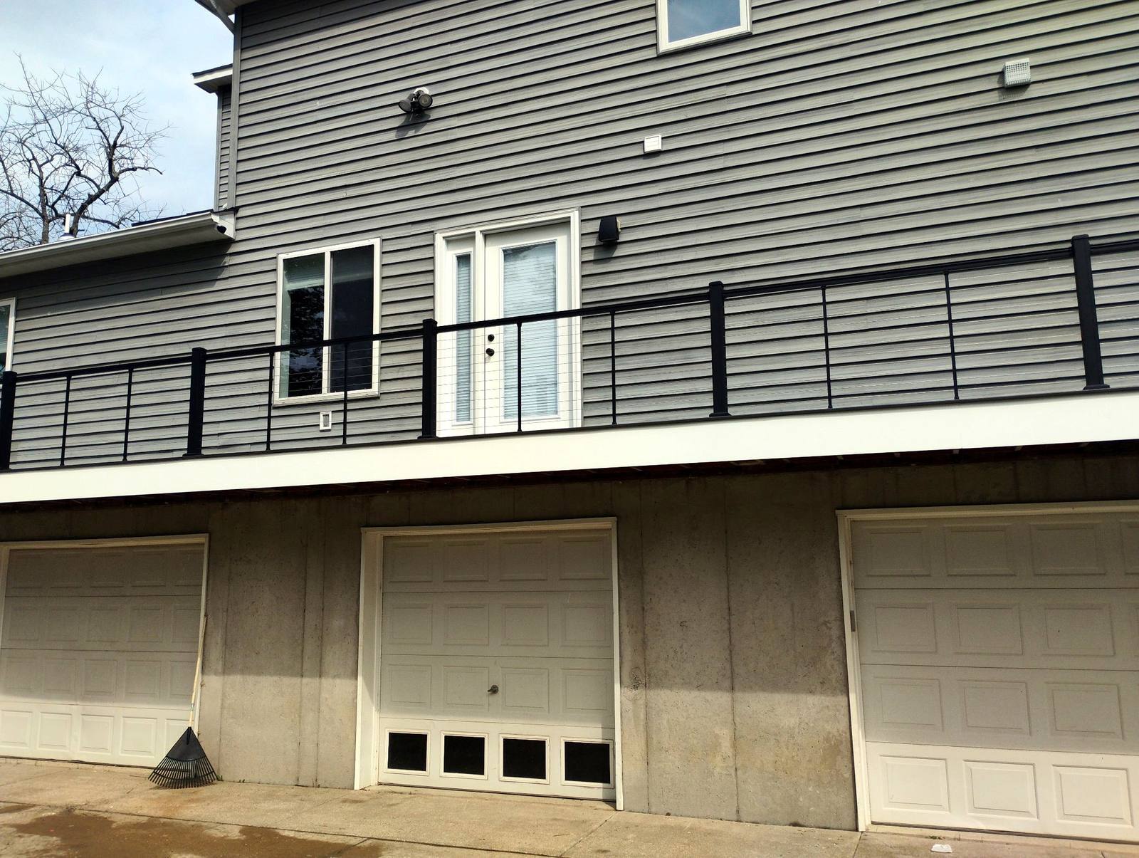 Finished upper balcony with black metal railing