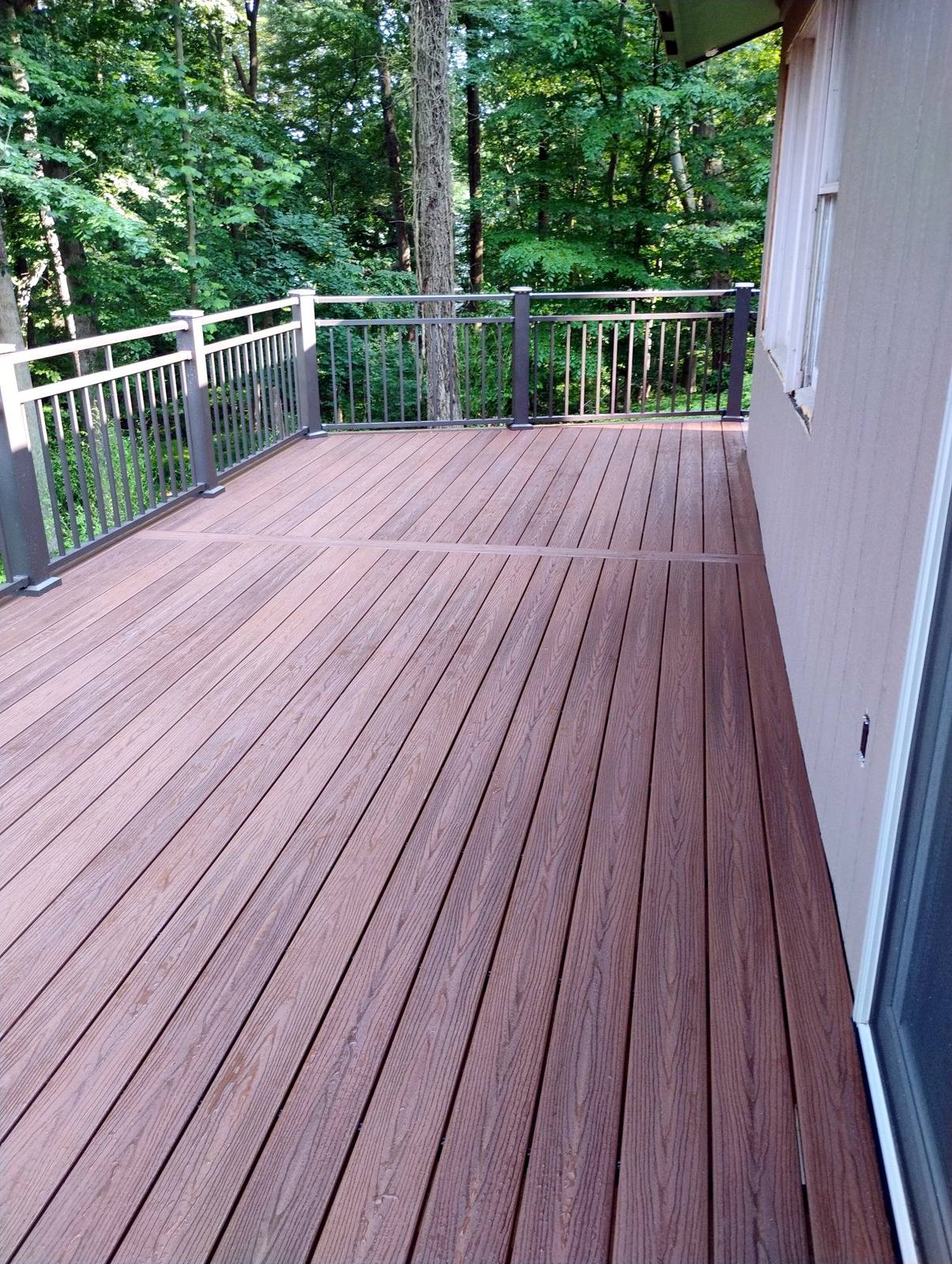 Completed wood deck surface and perimeter railing