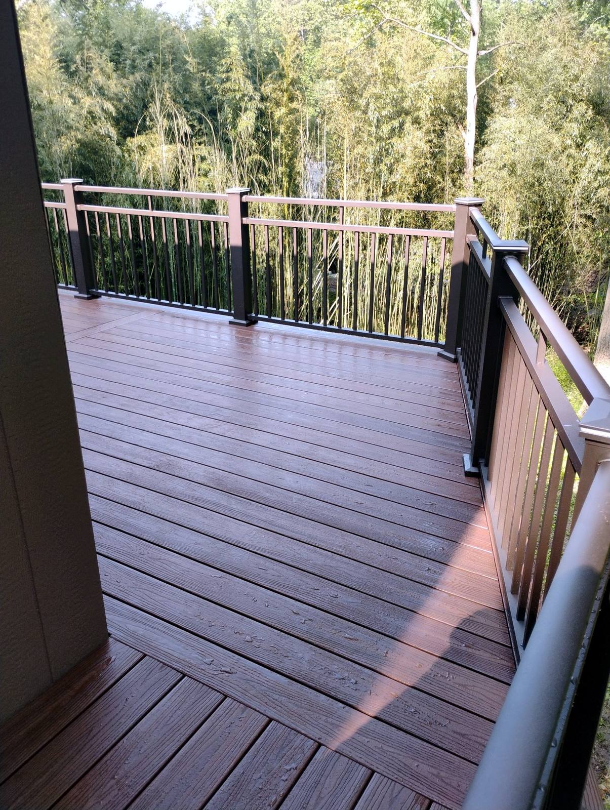 Finished deck walkway with wood and metal railing