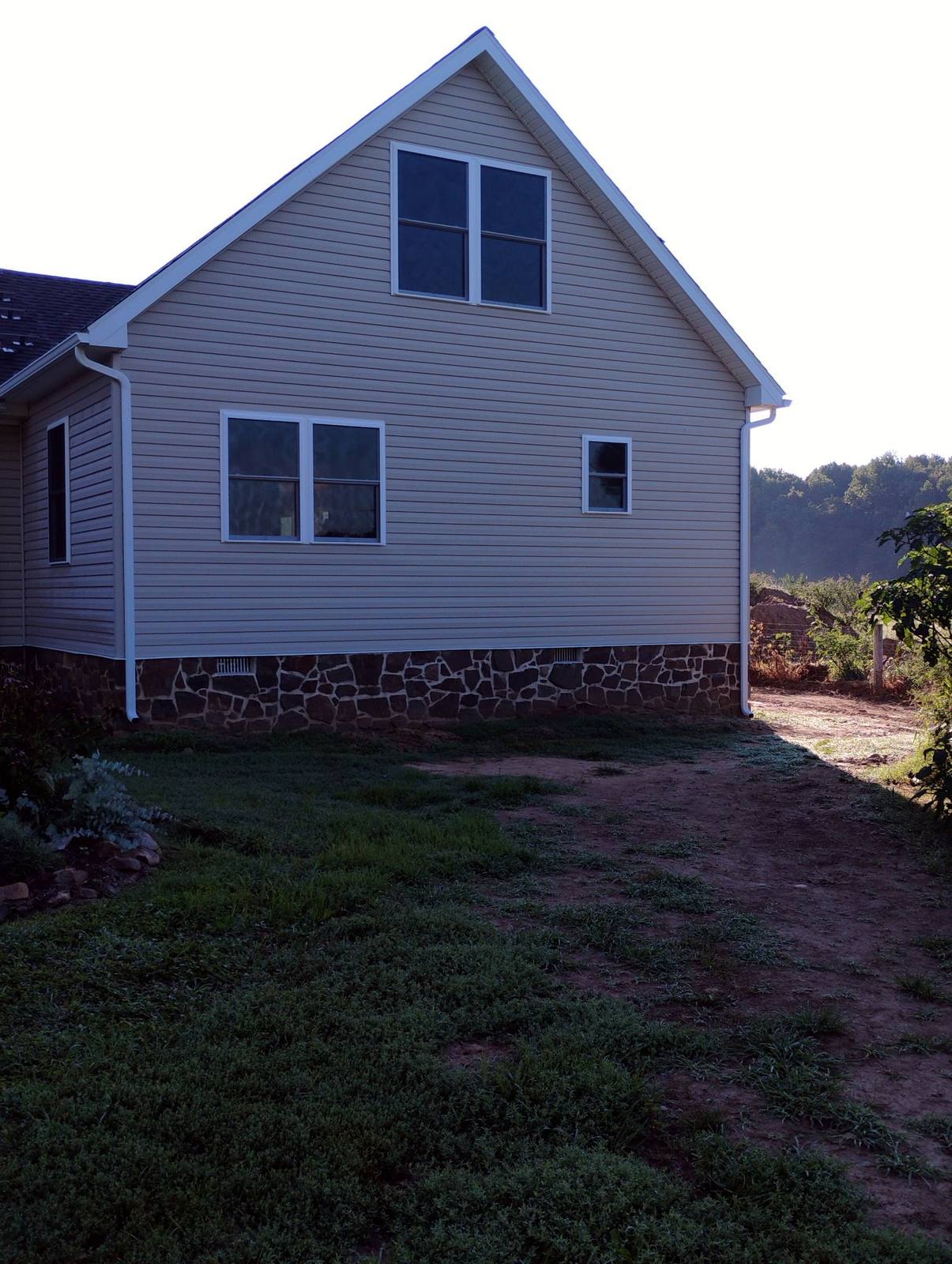 Rear view of a completed two-story white home