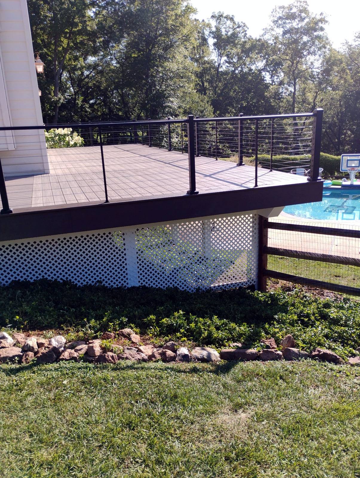 Finished raised deck with dark metal railings