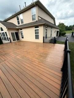Finished brown deck surface overlooking a backyard