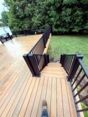 Completed deck stairs and railing viewed from above